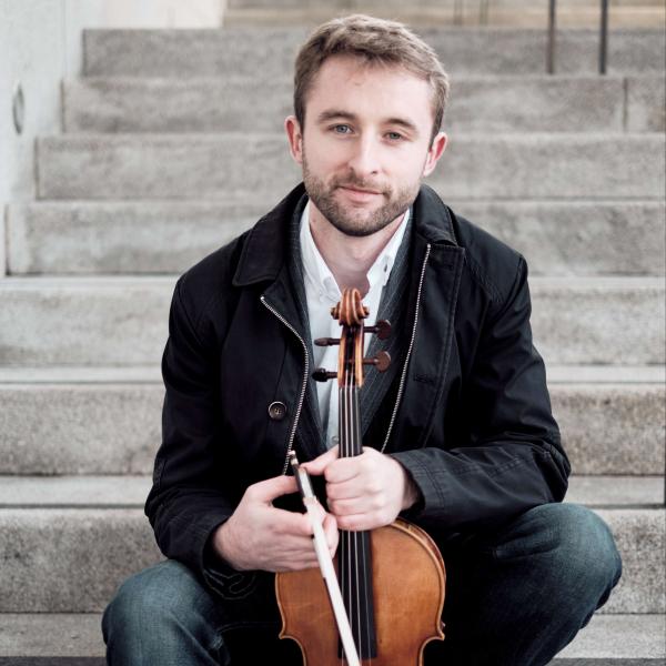 Man holding viola.
