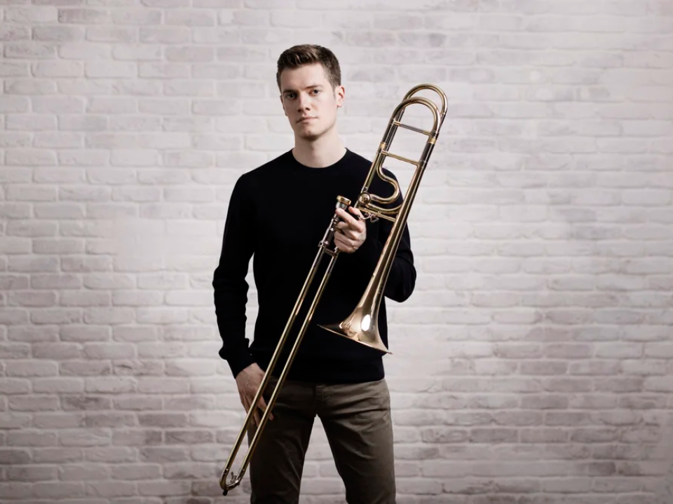 Peter Moore, trombonist starting with his instrument facing the camera