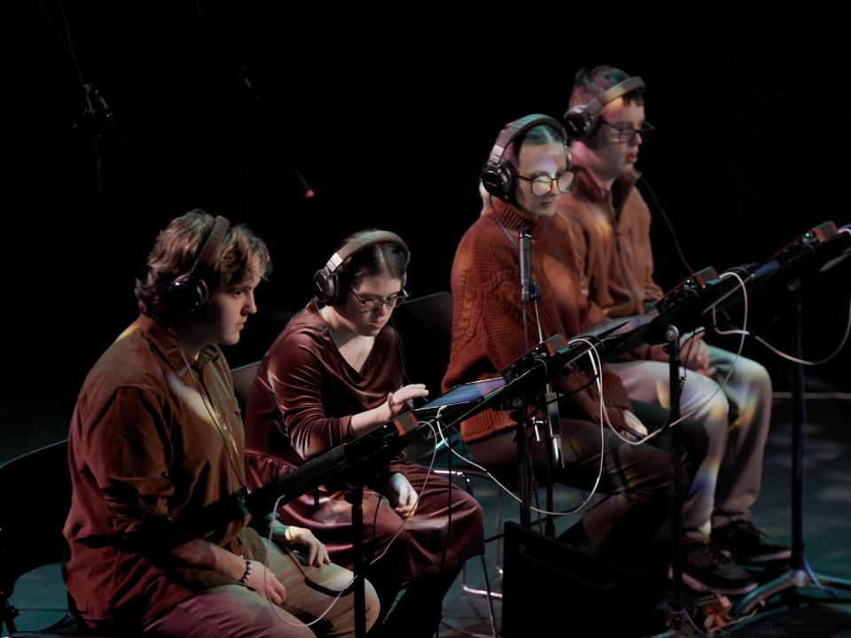 When Forests Sing Production Shot - Performaers sit at iPads in the Samuel Backett Theatre