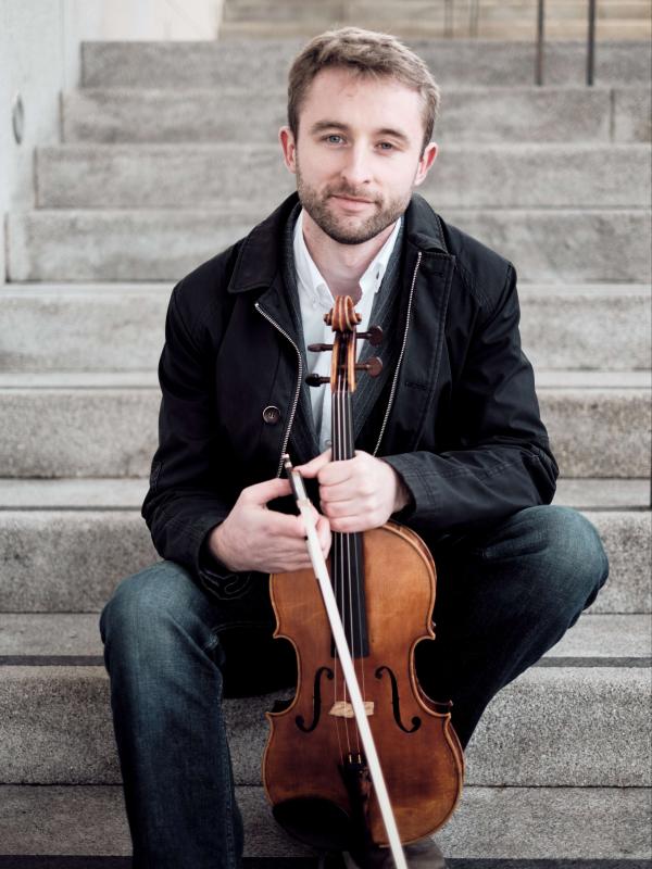 Man holding viola.